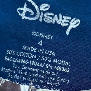 Lion King Torrid blouse, blue, iconic character, relaxed fit, short sleeves.